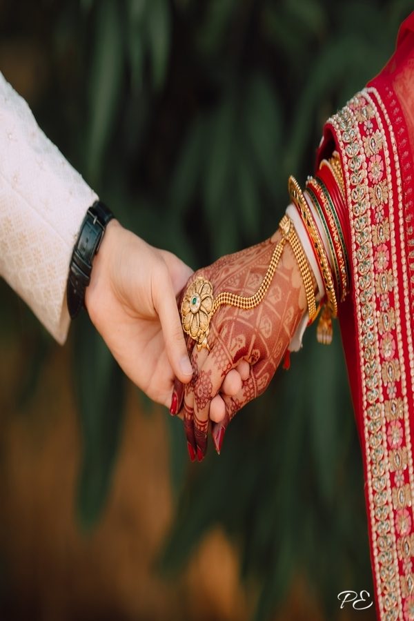 Indian Wedding Couple Holding Hands